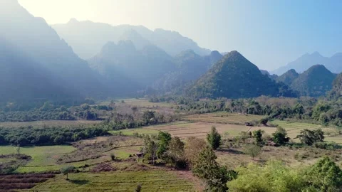 Mystic fertile valley and patchwork crops drone fly over, with soft Stock Footage 267201086