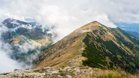 Mystic mountain hidden in dramatic clouds in alpine nature landscape Time lapse Stock Footage 116955506