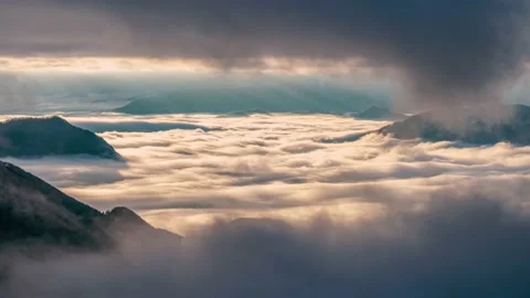Mystic mountain hidden in dramatic clouds alpine nature, misty clouds sky window Stock Footage 165934492