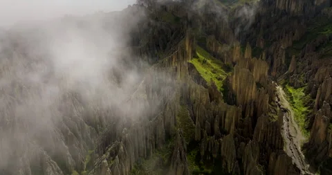 Mystical aerial view through thin clouds of Valle de las Animas towering spires Stock Footage 317219569