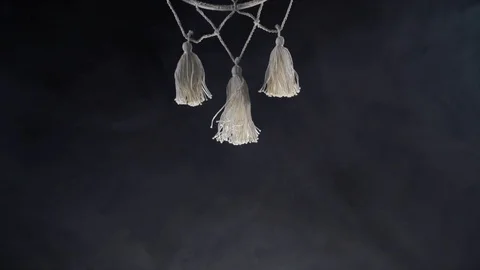 Mystical attribute dreamcatcher on a black background with smoke Stock Footage 127276913
