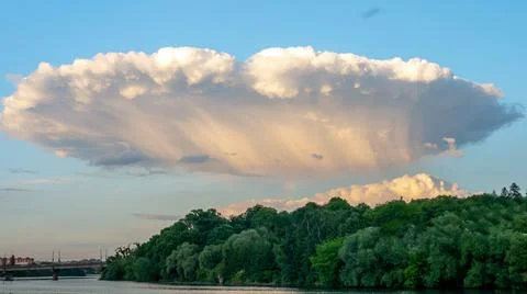 Mystical clouds, clouds in the form of an alien plate, beautiful sky Stock Photos