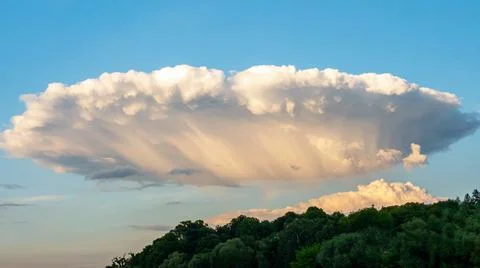Mystical clouds, clouds in the form of an alien plate, beautiful sky Stock Photos