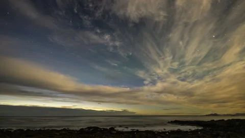 Mystical clouds with starry sky over the coast Stock Footage 250436377
