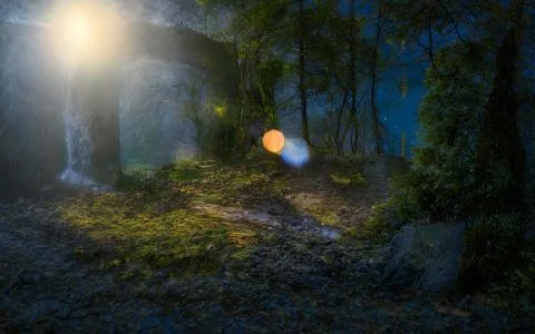Mystical forest path with bright light beam illuminating ancient stone arch.. Stock Photos