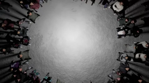 A mystical gathering. The camera rotates over the people standing on the grey Stock Footage 244661028