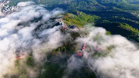 Mystical Green Hill Emerging from Dense White Mist and Fog Stock-Footage 334247409