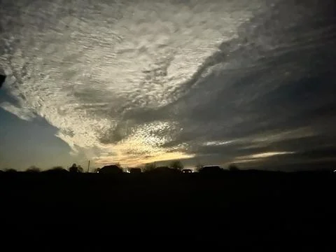 Mystical moonlight shining through dramatic winter clouds at night Fotos de archivo
