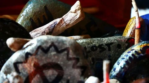 Mystical painted Viking drawing patterned spiritual pebbles colourful art Stock Footage 158932422