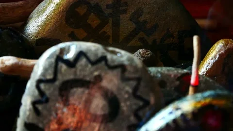 Mystical painted Viking drawing patterned spiritual stones colourful hobby Stock Footage 158932578