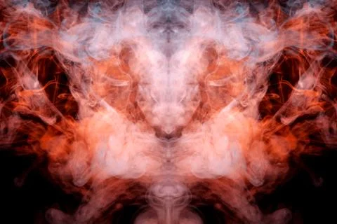 A mystical pattern of colored smoke of red and white in the shape of a ghost' Stock Photos