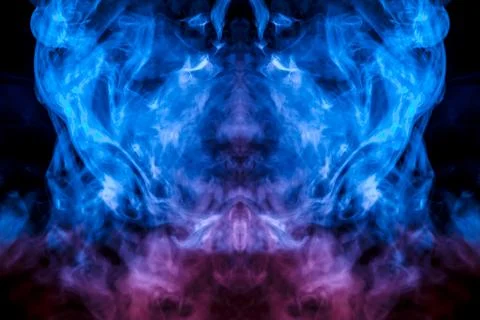 The mystical pattern of a person's face from evaporating smoke Stock Photos