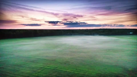 Mystical Post-Sunset, Veil of Fog Over Structured Fields Under a Crimson Sky Stock Footage 257763853