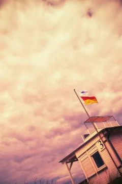 Mystically dramatic cloudy sky above a beach house with the number three, abs Stock Photos
