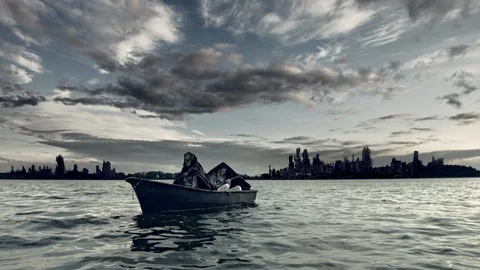 Mythical characters float on a boat on the river. Apocalypse. Stock Footage 96236280