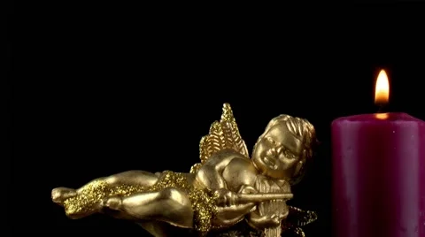 Mythological Angel Figurine &amp; Candle Stock Footage 59741239