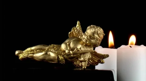 Mythological Angel Figurine &amp; Candles Stock Footage 59741399