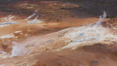 Myvatn, Bubbling pools of mud and steaming fumaroles emitting sulfuric gas Stock Footage 116202651