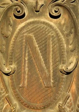 N, text, carved. Stock Photos