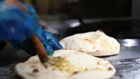 Naan Bread Being Buttered Stock Footage 102010850