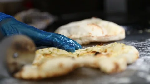 Naan Bread Being Cut Stock Footage 102011241