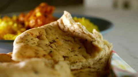 Naan bread with korma curry and rice in background Stock-Footage 218387514