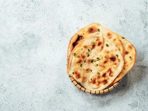Naan flatbreads on gray cement, copy space 스톡 사진