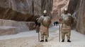 Nabatean soldiers in Siq - gorge that leads to Red Rose City Of Petra in Jordan HD Footage