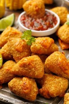 Nacho Cheese Bites with Salsa, Corn and Pickled Peppers on Wooden Board Stock Photos