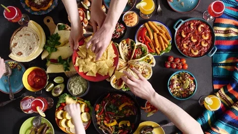 Nachos are a Tex-Mex culinary dish. Holiday in Mexico. Authentic Mexican family Stock Footage 276735331