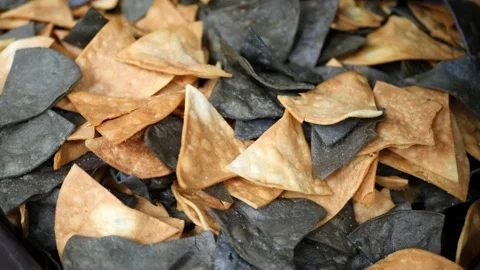 Nachos made from white corn and blue corn are ready to be served Stock Footage 203898427