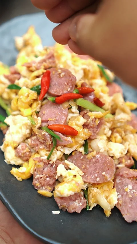 Naem Pad Kai, Thai stir-fried sour pork sausage with scrambled eggs. Stock Footage 337535715