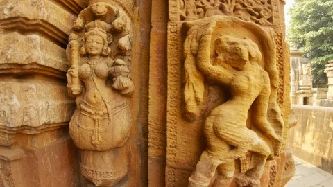 Naga and apsara indian deities bas-reliefs on wall of ancient hindu temple Rajar Stock Footage 106276201