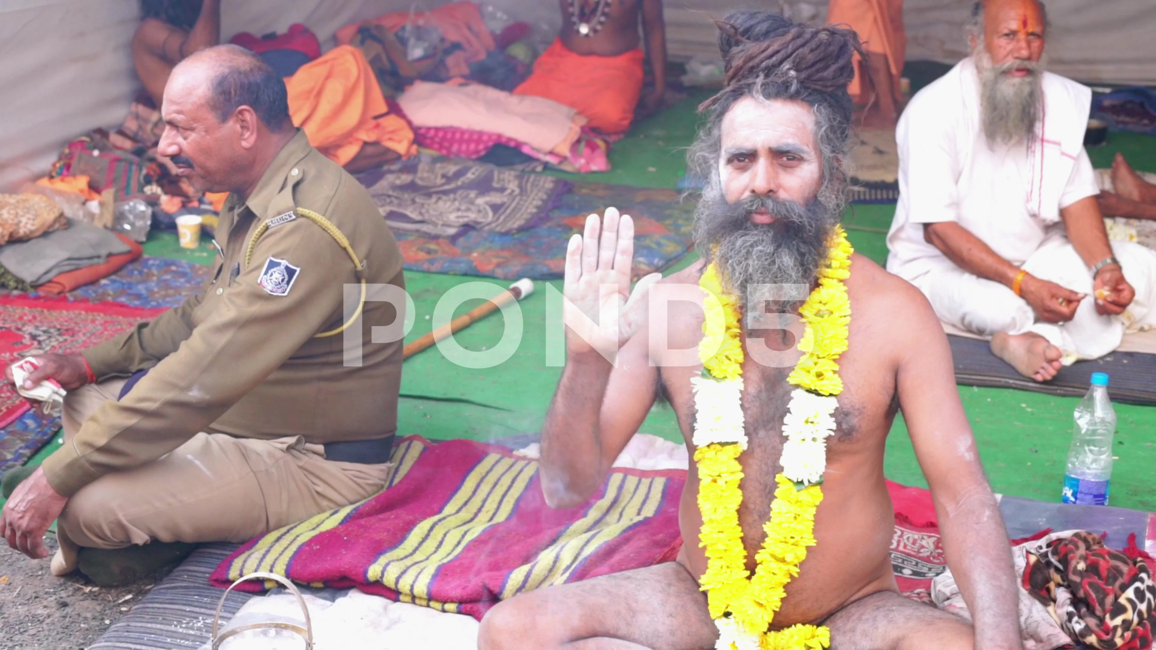 Naga Sadhu Baba Sitting on Road and Meet... | Stock Video | Pond5