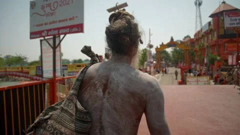 Naga Sadhu walking alone during in Kumbh mela haridwar Stock Footage 214324089