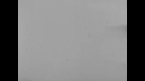 NAGASAKI 1940s: A devastated landscape shows debris-strewn ground and charred Stock Footage 341983108