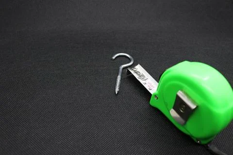 A nail and Building meter Stock Photos