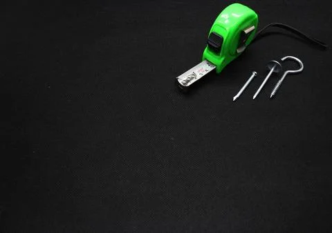 A nail and Building meter Stock Photos