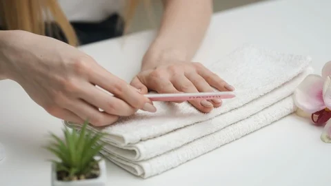 Nail care. Preparing for a manicure. A close-up plan Stock Footage 128987668