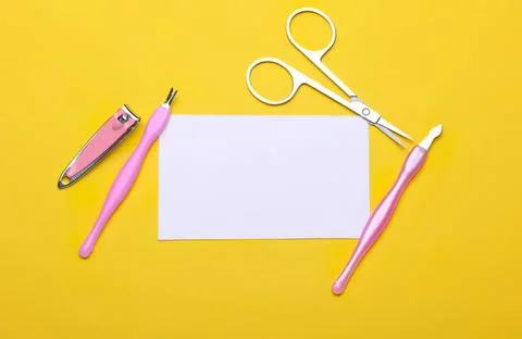 Nail care tools with scissors on yellow background 스톡 사진