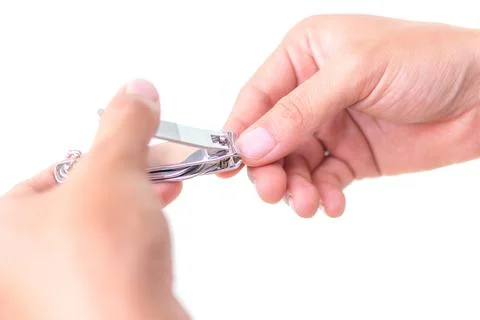 Nail clipper in hands Stock Photos