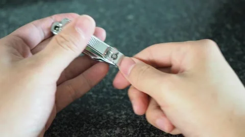 Nail clipping using the clipper close up Stock Footage 129492506