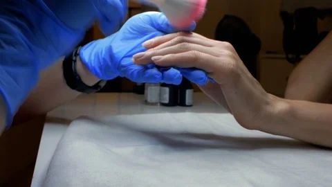 Nail dusting with a special soft brush, manicure in process. Slow Motion Stock Footage 114314649