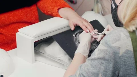 Nail extension procedure. Applying gel to the nail. Nude coating Stock Footage 295507383