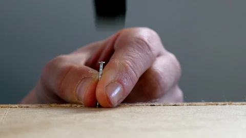 A nail is hammered in a flat pack Stock-Footage 98663545