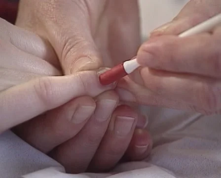 Nail manicure - pushing back the cuticles and scrape under the nails Stock Footage 60421872
