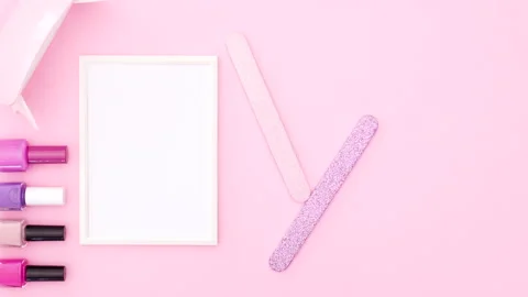 Nail manicure tools appear on left side of pink theme. Stop motion Stock Footage 141174419