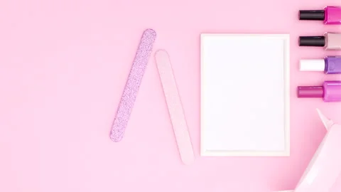 Nail manicure tools appear on right side of pink theme. Stop motion Vídeo Stock 141174709