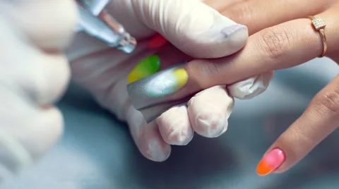 Nail master airbrushing. Manicurist making butterfly HD Stock Footage 58519085