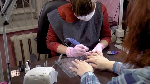 Nail master use electric file nail drill Video stock 103732293